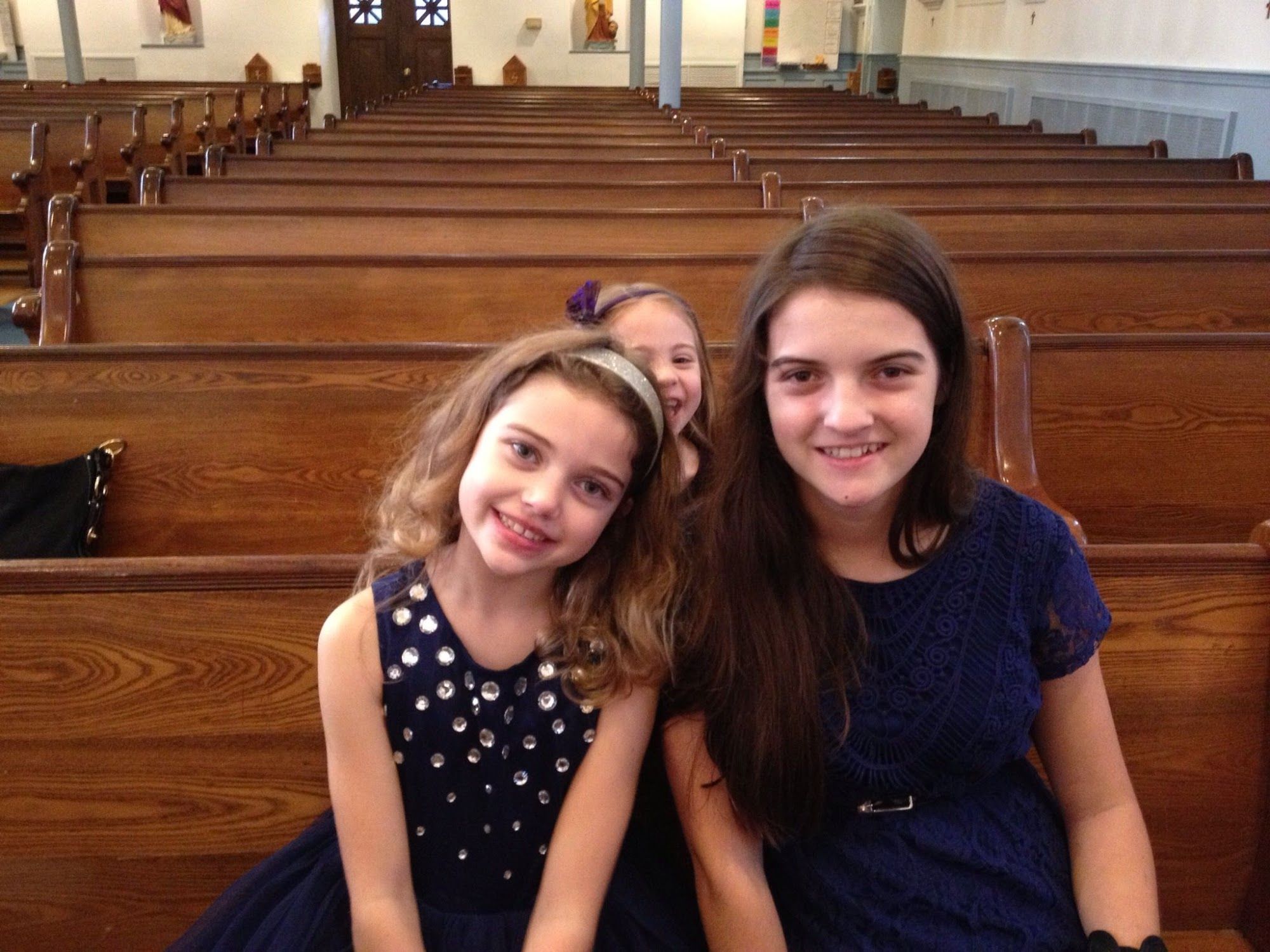 My nieces ready for their sister's baptism.Yes, that is Buggy photobombing.