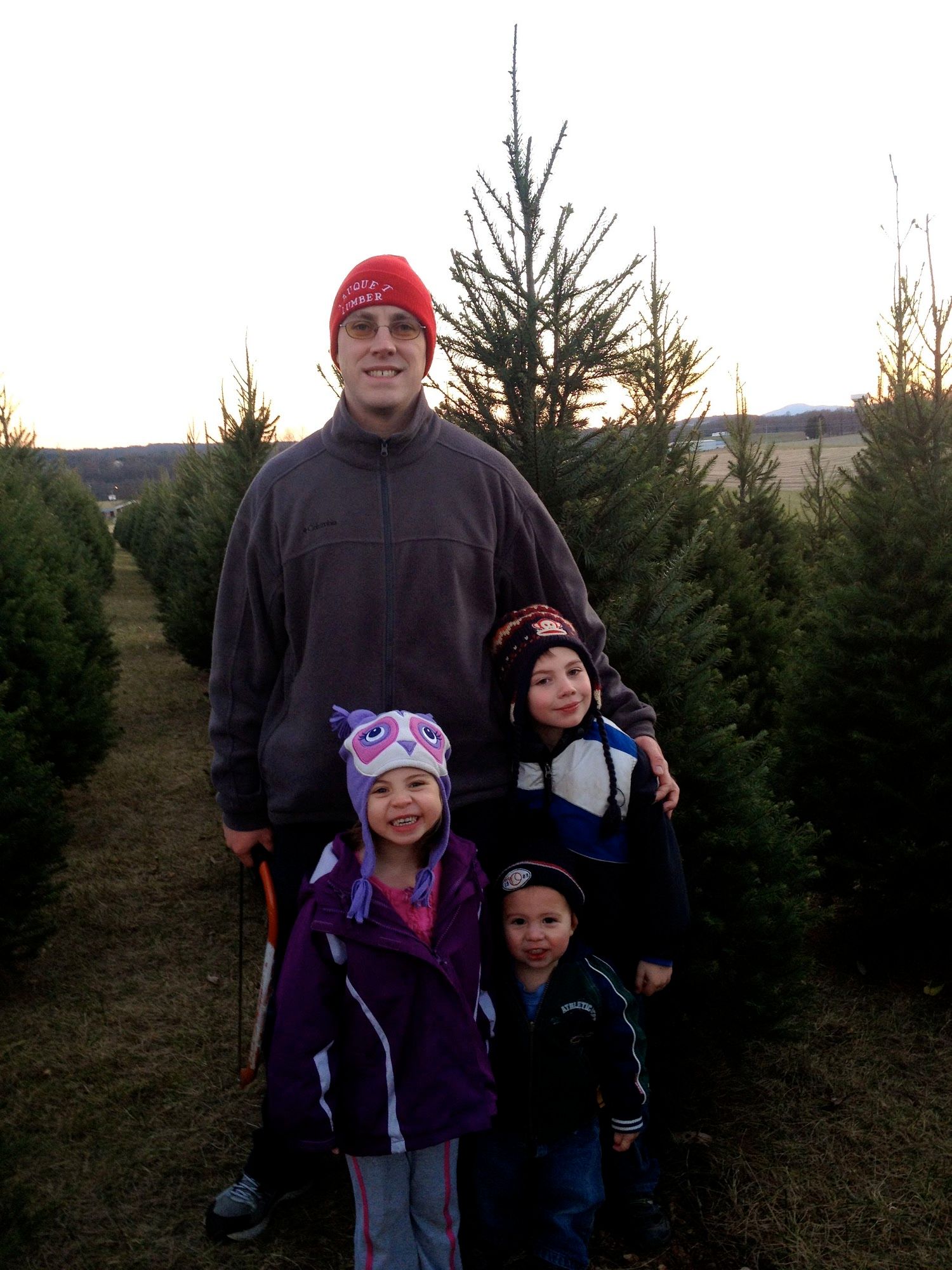 Hubby and the kids picking out our Christmas tree
