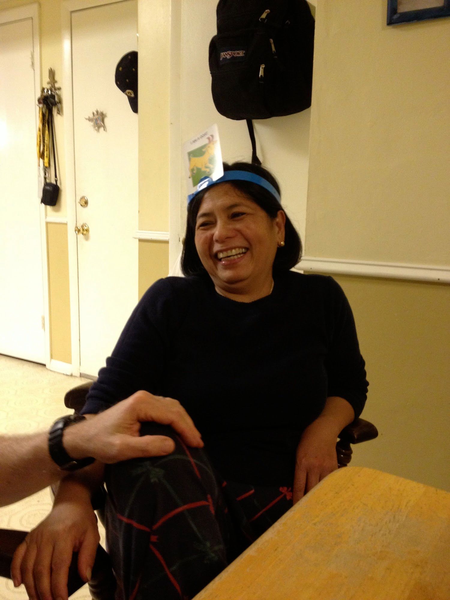 My Mom playing Headbanz.I love this picture of her because she is clearly laughing and having a good time