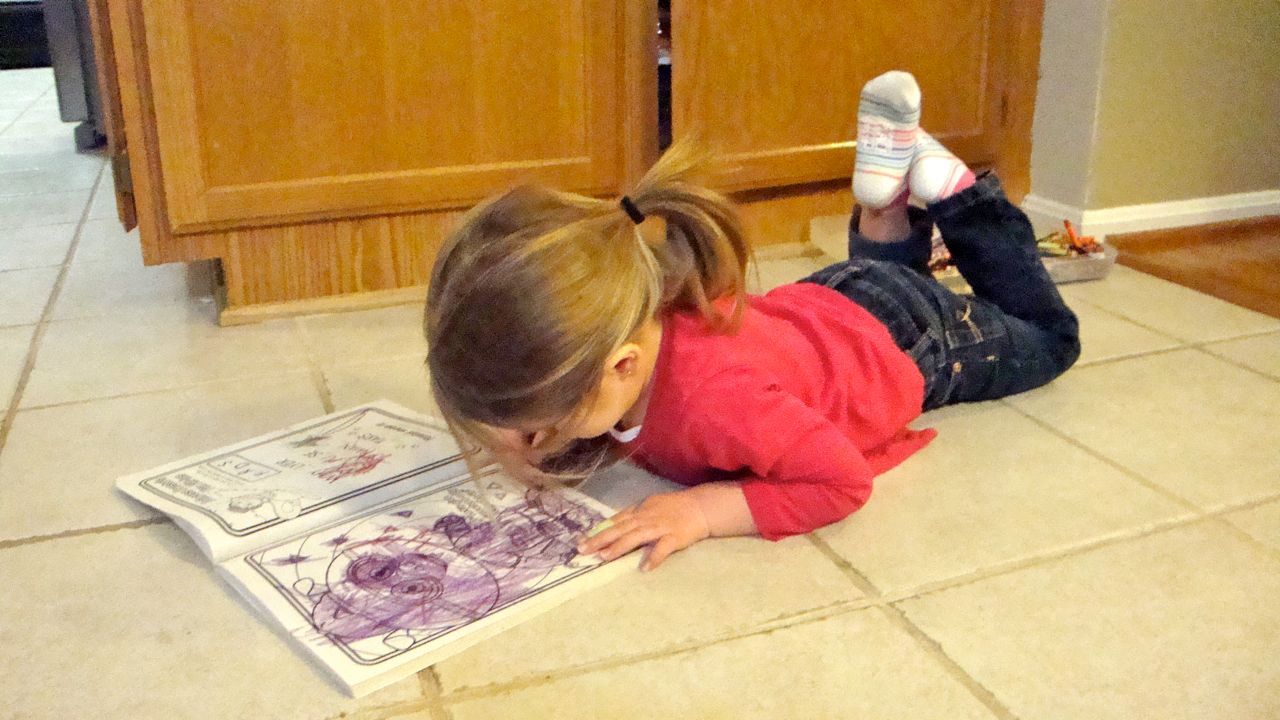  Busy coloring before dinner. LOVE HER! 