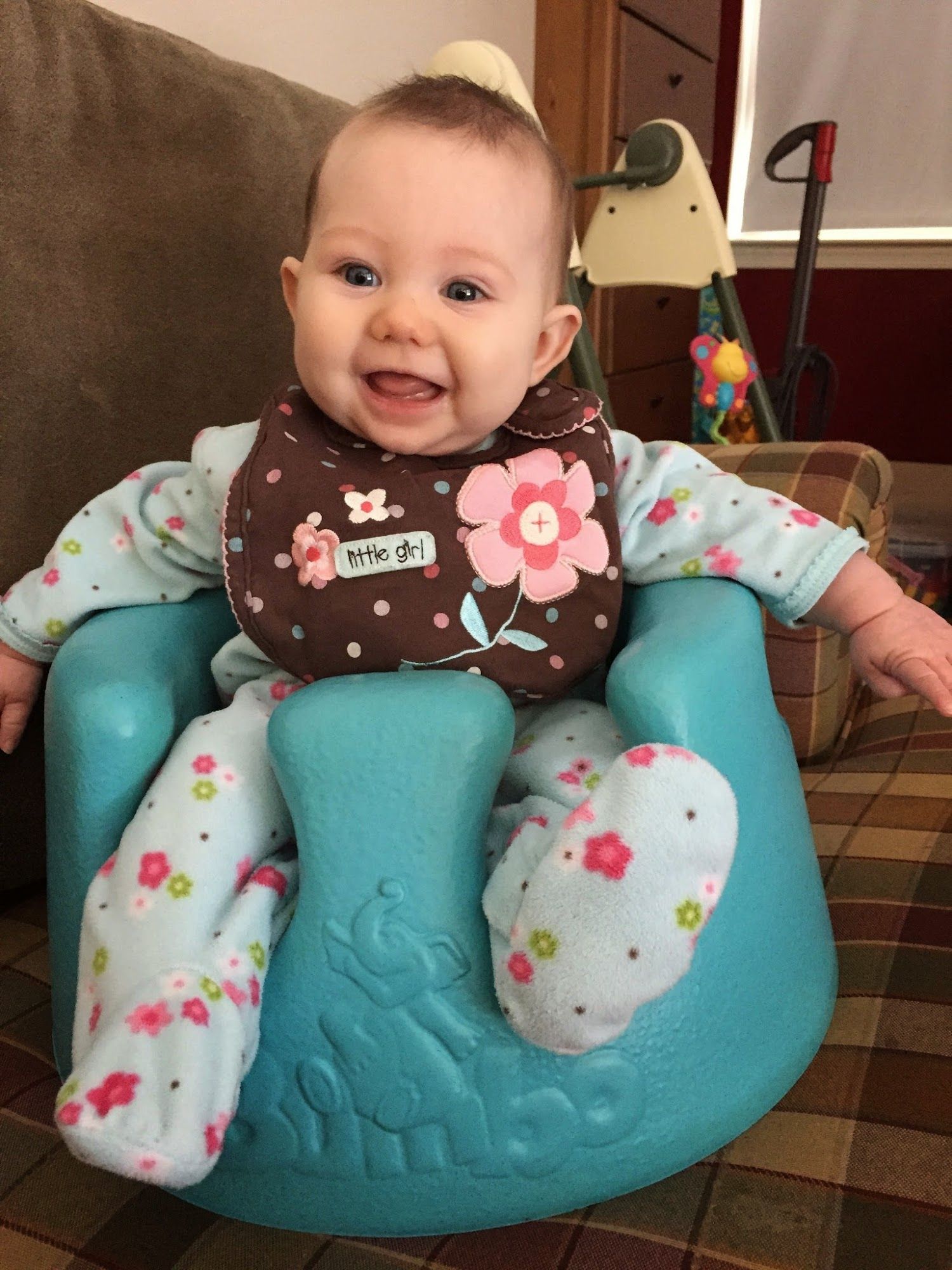  Bean loves hanging out in the Bumbo. 