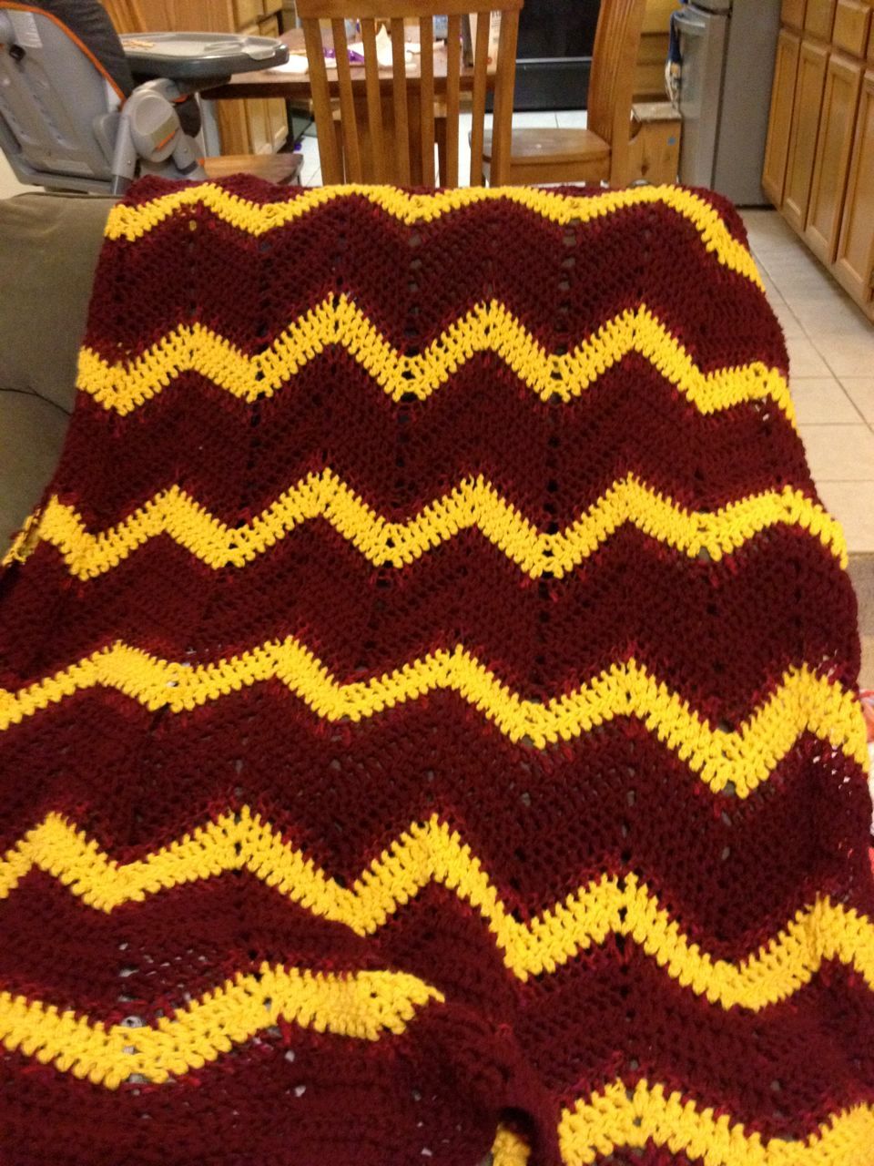 Elon inspired full-length afghan.You can't tell from the picture,but there is another color between the maroon and yellow.