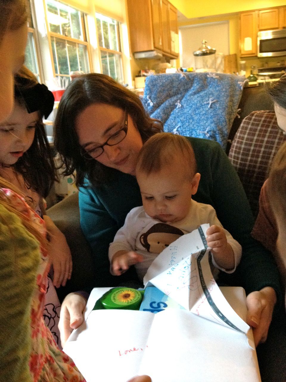 One of my favorite pictures. Mr. B. with his Godmother, surrounded by cousins.