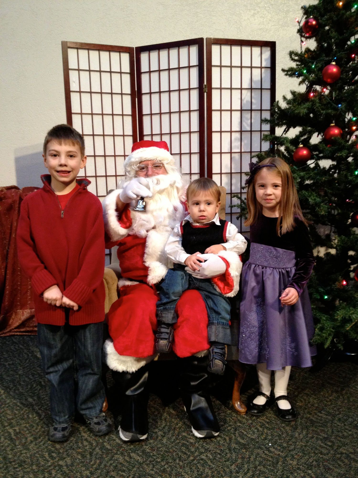 The kids hanging with Santa