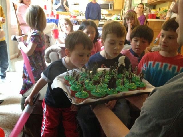 The boys' celebrating their birthdays together with a Star Wars theme.