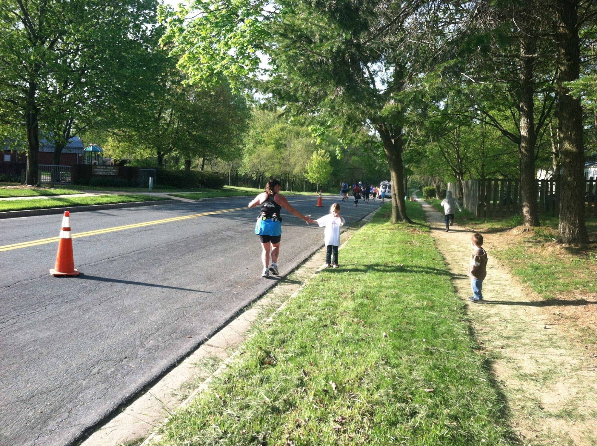  Buggy getting a high five from a runner with Mr. Bananas watching from the side. 