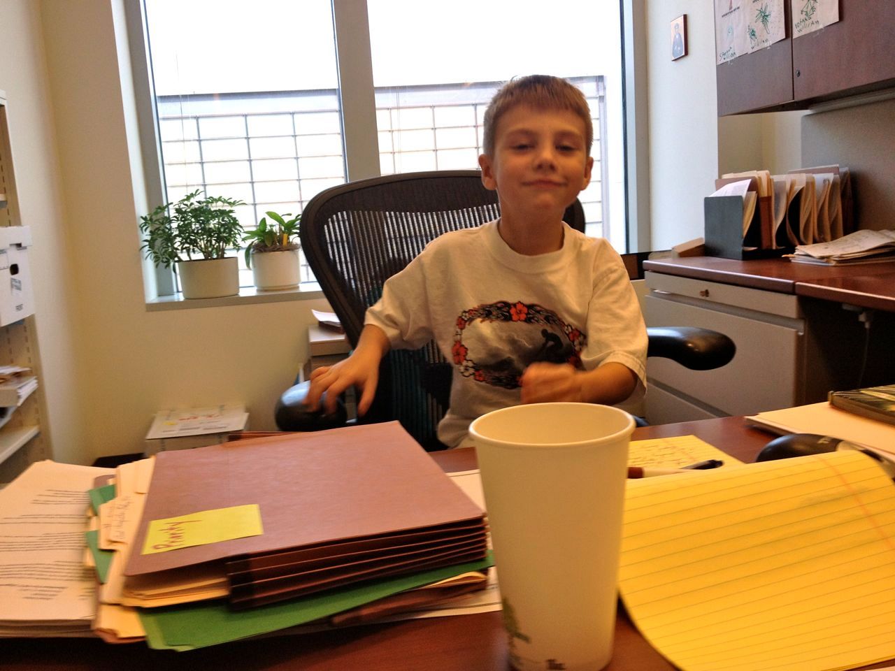 Trying to look like Daddy at work.