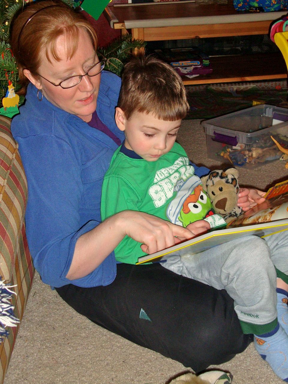 Boogie reading a book given to him by his Godmother.
